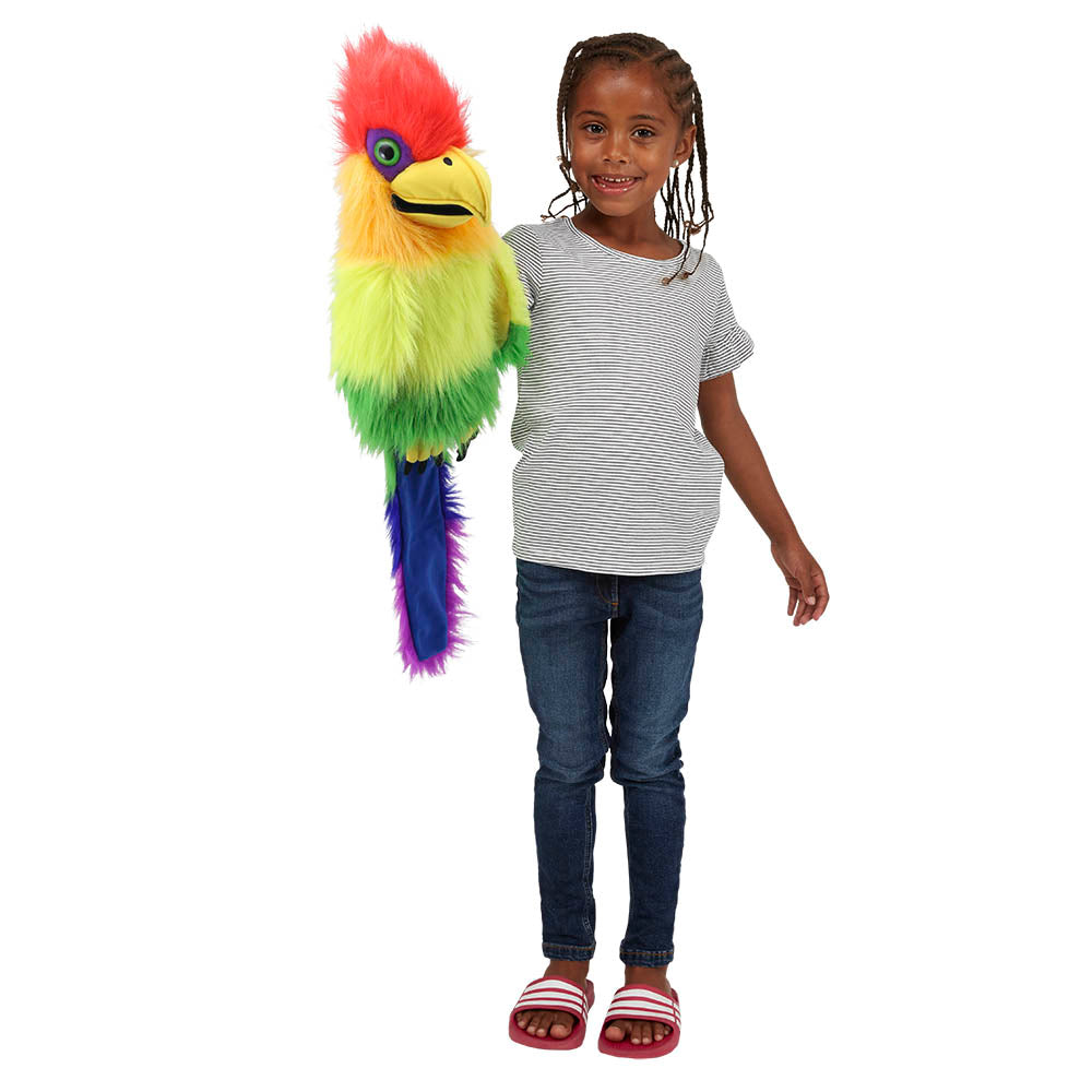 Child playing with the Rainbow Bird glove puppet